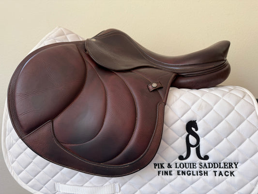 A brown Antares limited edition saddle with a 1A flap, displayed on a white saddle pad.